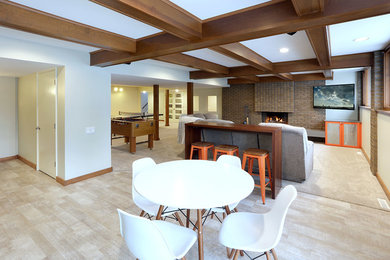 Example of a mid-sized 1960s look-out light wood floor and beige floor basement design in Grand Rapids with white walls, a standard fireplace and a brick fireplace