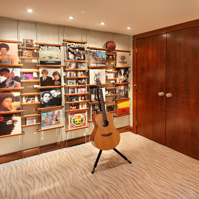 Trendy underground carpeted basement photo in Minneapolis with beige walls