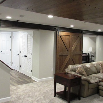 Ijamsville, MD Basement with cool barn doors by Talon Construction