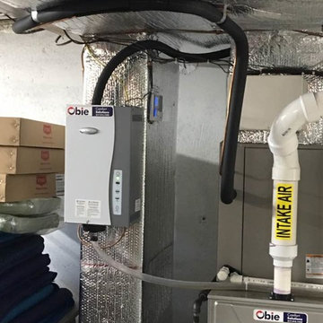 Installation of a hybrid system gas furnace with a heat pump.