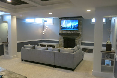 Mid-sized transitional look-out porcelain tile basement photo in Chicago with a stone fireplace