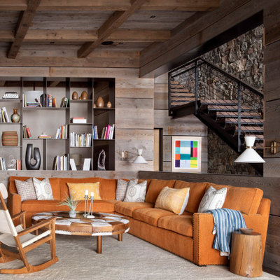 Basement - mid-sized rustic walk-out dark wood floor and brown floor basement idea in Other with brown walls