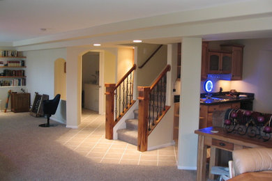 Inspiration for a large timeless look-out carpeted and gray floor basement remodel in Denver with gray walls