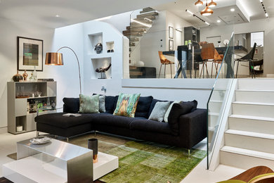 Design ideas for a modern basement in London with white walls and porcelain flooring.
