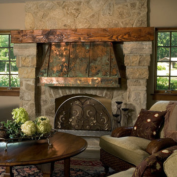 Lower Level Family Room with Floor to Ceiling Stone Fireplace and Copper Hood