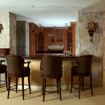 Lower Level Wet Bar with Stone Walls and Distressed Cherry Cabinetry