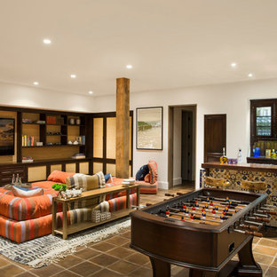 Example of a tuscan brown floor basement design in Seattle with beige walls