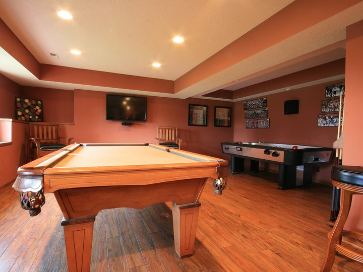 A medium-sized elegant basement photo with carpet and beige walls.