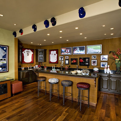 Tuscan dark wood floor basement photo in Phoenix with green walls and a bar