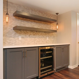 Inspiration for a large modern underground basement remodel in Grand Rapids with gray walls