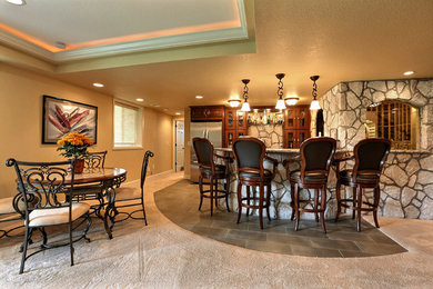 Open Basement Concept in Centennial, CO with tray ceilings and stacked stone