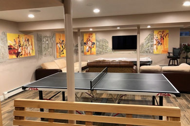 Photo of a large contemporary look-out basement in Boston with multi-coloured walls, porcelain flooring and multi-coloured floors.