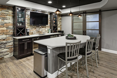 Home bar - large contemporary light wood floor and beige floor home bar idea in Denver