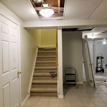 Refinished Basement with Baby Blue Walk-Up Bar