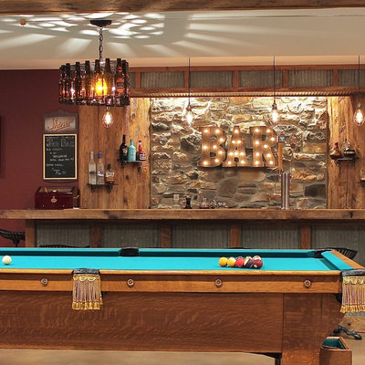 Mid-sized mountain style underground concrete floor and beige floor basement photo in Philadelphia with brown walls