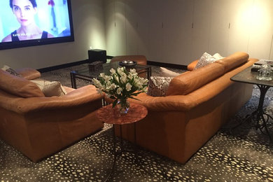 Mid-sized eclectic underground carpeted basement photo in New York with beige walls and no fireplace