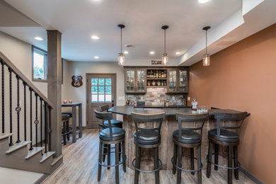 Inspiration for a rustic home bar remodel in Milwaukee