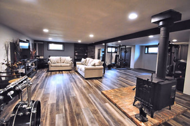Mid-sized urban look-out vinyl floor and multicolored floor basement photo in New York with white walls and no fireplace