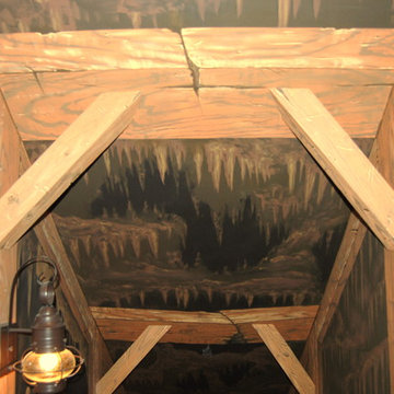 The Bat Cave Themed Mural in a stairway and lower level by Tom Taylor