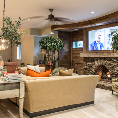 Large mountain style look-out carpeted and beige floor basement photo in St Louis with beige walls, a standard fireplace and a stone fireplace