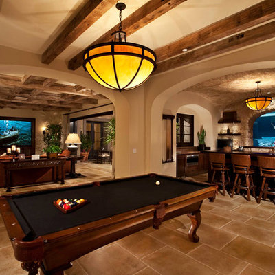 Example of a mid-sized classic underground ceramic tile and brown floor basement design in Orange County with beige walls and no fireplace