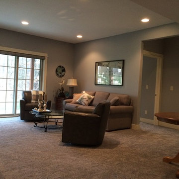 Urbandale basement with built in cabinets.