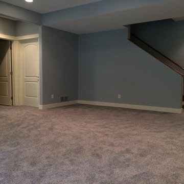 Urbandale basement with built in cabinets.