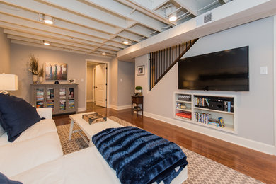 Basement - large traditional look-out dark wood floor basement idea in Birmingham with gray walls and no fireplace