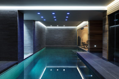 Photo of a large contemporary swimming pool in London.