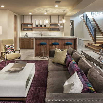 Trendy underground concrete floor basement photo in Omaha with beige walls