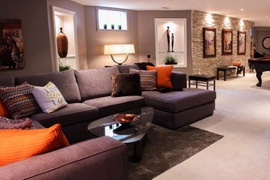 Basement - traditional carpeted basement idea in Toronto with beige walls