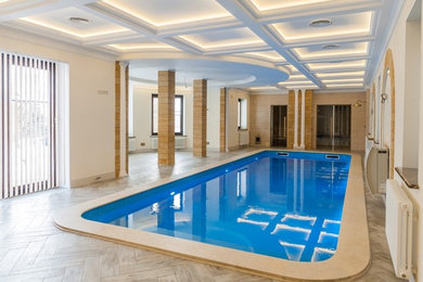 На фото: большой бассейн в доме в современном стиле