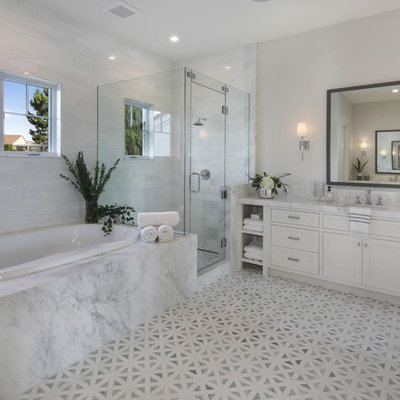 Transitional master white tile gray floor bathroom photo in Orange County with shaker cabinets, white cabinets, gray walls, an undermount sink, a hinged shower door and white countertops