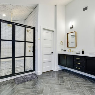 Inspiration for a modern master white tile and subway tile gray floor double shower remodel in Austin with shaker cabinets, black cabinets, white walls, a drop-in sink, a hinged shower door and white countertops