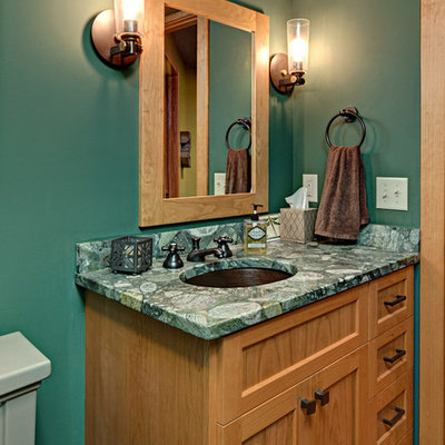 Inspiration for a mid-sized craftsman bathroom remodel in Minneapolis with shaker cabinets, medium tone wood cabinets, green walls, an undermount sink and multicolored countertops