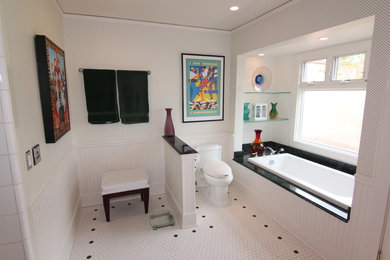 This is an example of a large classic ensuite bathroom in San Diego with a submerged sink, freestanding cabinets, dark wood cabinets, granite worktops, a built-in bath, a two-piece toilet, white tiles, white walls, ceramic flooring, a corner shower, mosaic tiles, white floors and a hinged door.