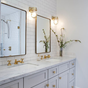 Inspiration for a transitional white tile and subway tile mosaic tile floor bathroom remodel in San Diego with shaker cabinets, white cabinets, white walls and an undermount sink