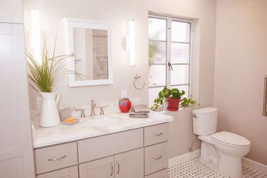 Inspiration for a transitional master black and white tile walk-in shower remodel in Phoenix with shaker cabinets, white cabinets, a one-piece toilet and marble countertops