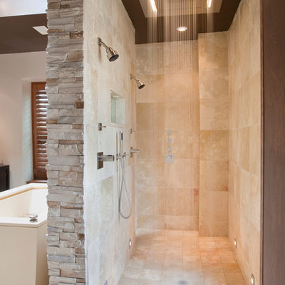 Example of a trendy travertine tile double shower design in DC Metro