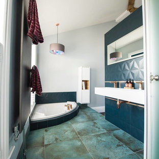 Inspiration for a medium sized modern bathroom in Cheshire with a japanese bath, grey walls, a wall-mounted sink and green floors.
