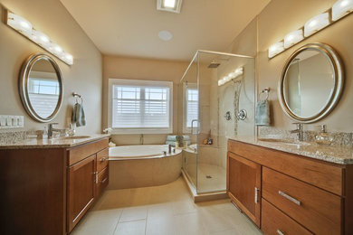 Example of a transitional master beige tile and porcelain tile porcelain tile bathroom design in Other with granite countertops, an undermount sink, shaker cabinets and medium tone wood cabinets