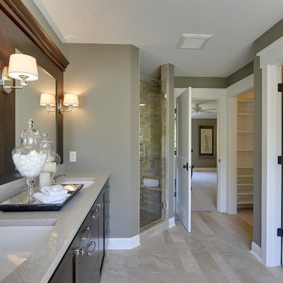 Inspiration for a timeless beige floor corner shower remodel in Minneapolis with an undermount sink