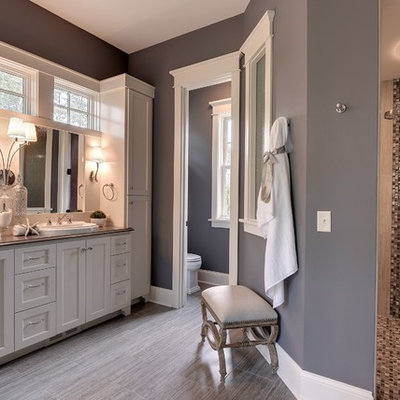 Inspiration for a timeless beige tile bathroom remodel in Minneapolis with a drop-in sink, shaker cabinets and white cabinets