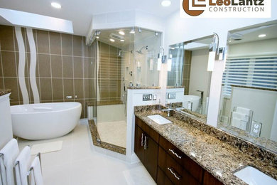 Example of a large trendy master white tile and ceramic tile ceramic tile bathroom design in Richmond with flat-panel cabinets, dark wood cabinets and granite countertops