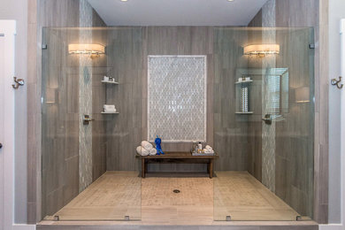 Large trendy master gray tile and ceramic tile ceramic tile double shower photo in Other with shaker cabinets, gray cabinets, a one-piece toilet, gray walls, an undermount sink and quartz countertops