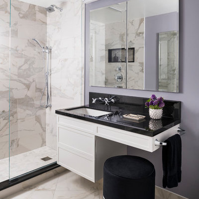 Inspiration for a small contemporary 3/4 white tile and marble tile marble floor and white floor alcove shower remodel in New York with purple walls, black countertops, recessed-panel cabinets, white cabinets, an undermount sink and solid surface countertops