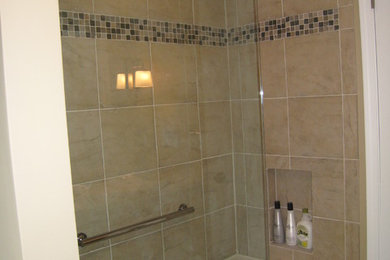 Doorless shower - mid-sized transitional beige tile and ceramic tile porcelain tile doorless shower idea in Detroit with a drop-in sink, shaker cabinets, dark wood cabinets, quartz countertops, a one-piece toilet and beige walls