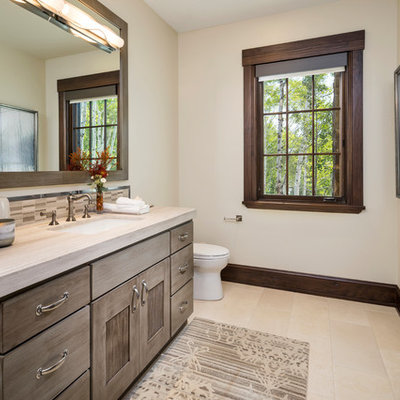 Bathroom - huge rustic brown tile and mosaic tile beige floor bathroom idea in Salt Lake City with gray cabinets, marble countertops, recessed-panel cabinets, white walls, an undermount sink and beige countertops