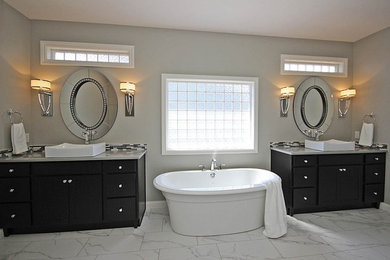 Example of a large classic master white tile and marble tile marble floor bathroom design in Chicago with beaded inset cabinets, dark wood cabinets, gray walls, a vessel sink and quartz countertops