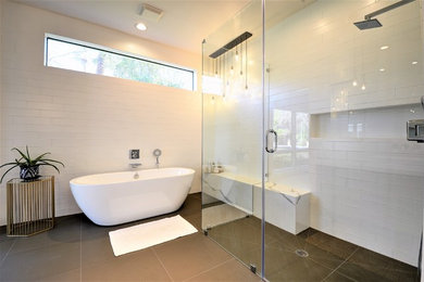 Bathroom - large modern master white tile and subway tile porcelain tile and gray floor bathroom idea in Phoenix with shaker cabinets, medium tone wood cabinets, a two-piece toilet, white walls, a vessel sink, granite countertops and a hinged shower door